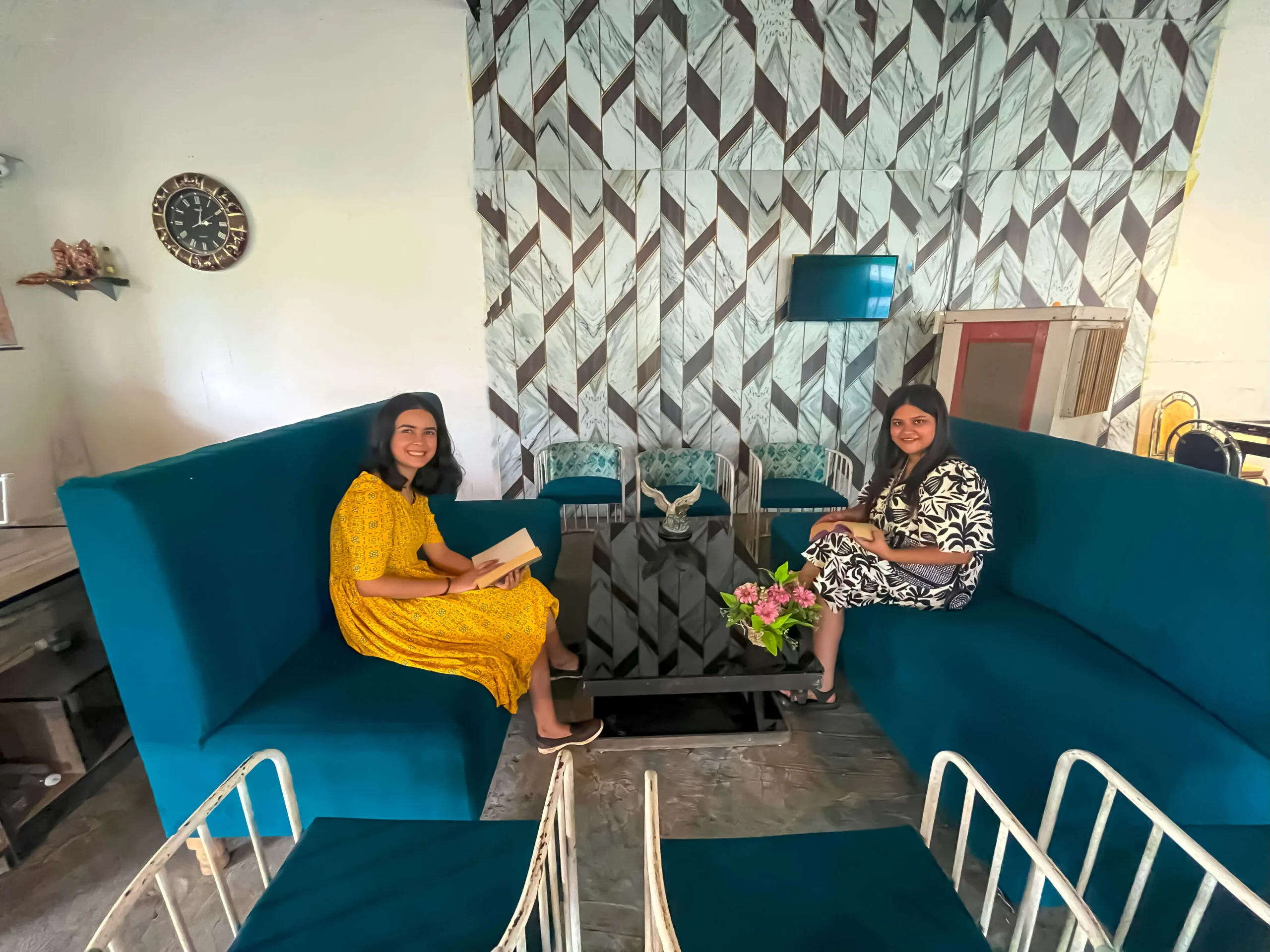 Scenic view of a tranquil resort area with well-manicured gardens and mountain vistas.