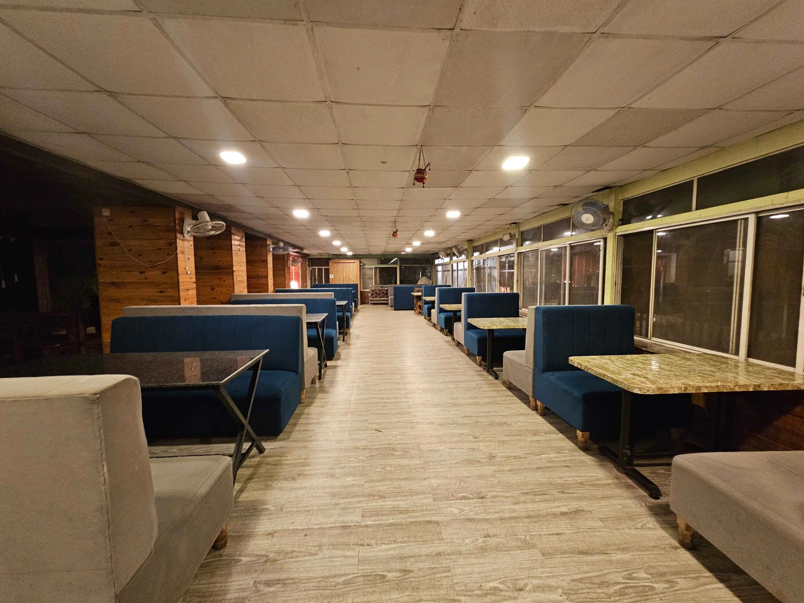 Luxurious restaurant setup with beautifully arranged tables and ambient lighting.